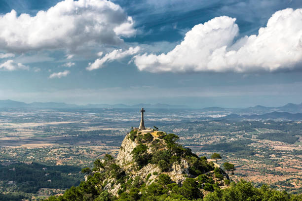 istock Cross at the top of a hill 937134788