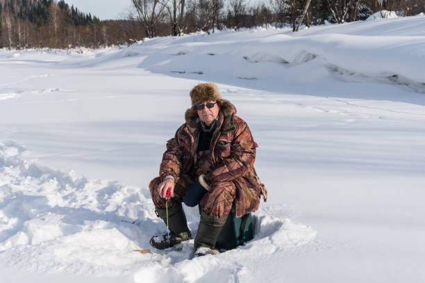 istock Winter fisherman 937137988