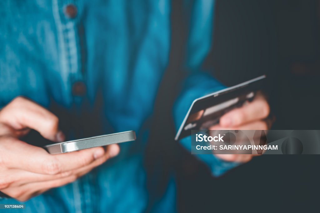 Online banking businessman using smartphone with credit card Fintech and Blockchain concept Credit Card Stock Photo