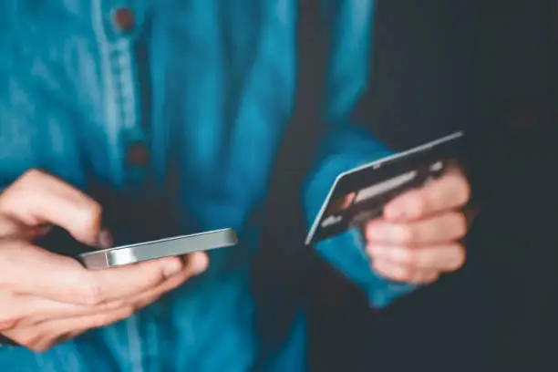 Photo of Online banking businessman using smartphone with credit card Fintech and Blockchain concept