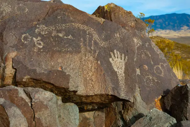 Native American art on rock outcrop at Three Rivers Petroglyph Site.