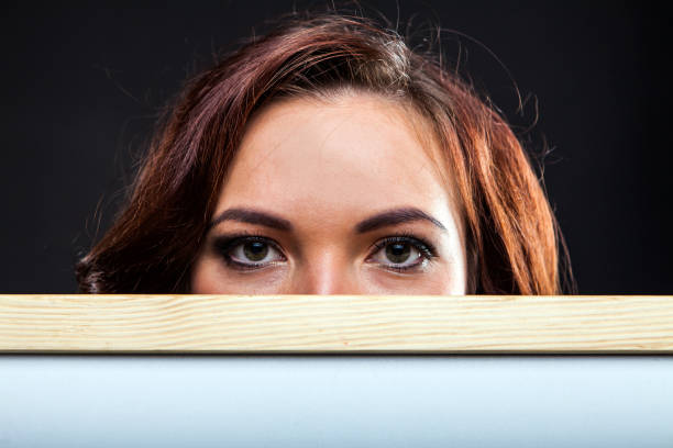 istock Pretty young girl holding whiteboard 937141172