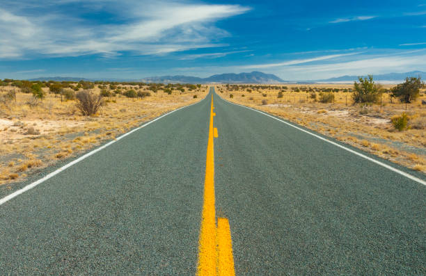 istock Desert Road Leading to Distance 937141376