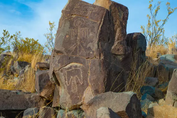 Native American art on rock outcrop at Three Rivers Petroglyph Site.