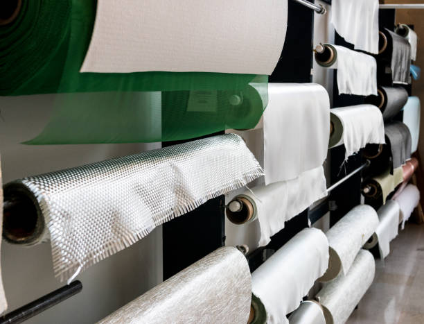 istock Fiberglass composite fabrics hanging on a wall dispenser 937149878
