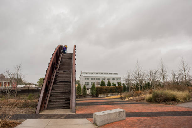 New Orleans, LA\\USA - Jan. 27, 2018: Steps going up the giant arched bridge that gives entry to Crescent Park, a beautiful and scenic park in the Marigny / Bywater area outside the French Quarter.