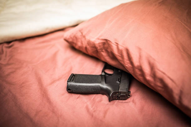 istock Hidden under pillow gun for personal protection 937150766