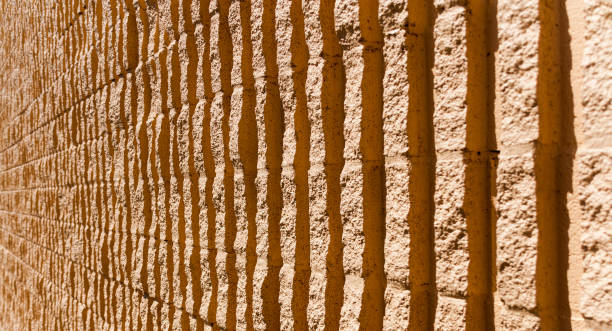 istock Orange stone wall background fading in the distance 937153984