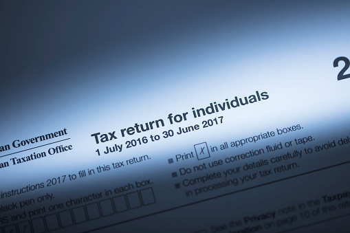 Pen on tax form 1040. Business concept. April 2021