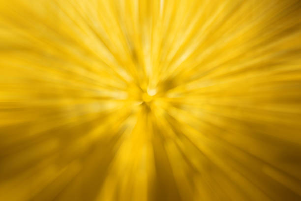 istock Abstract blurred yellow light by radial effect from water drop at the windscreen bokeh background 937162244