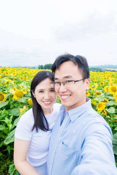 istock couple selfie with sunflower 937168232