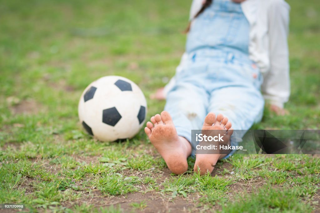 Little girl playing with a soccer ball 4-5 Years Stock Photo