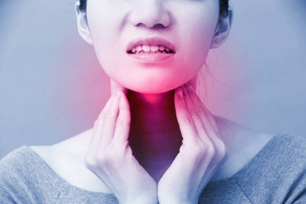 women with thyroid gland problem women with thyroid gland problem on the blue background thyroid disease stock pictures, royalty-free photos & images