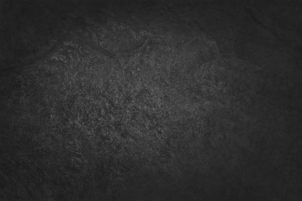 istock Dark grey black slate texture in natural pattern with high resolution for background and design art work. Black stone wall. 937176094