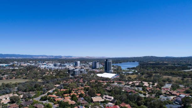 Aerial from Bruce suburb looking towards Belconnen town centre High aerial viewpoint photographed by a DJI Phantom 4pro, looking towards buildings residential homes in foreground and Belconnen town centre and lake Ginninderra in the background, photographed on a nice sunny day. belconnen stock pictures, royalty-free photos & images