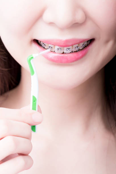 istock woman take interdental brush 937180380