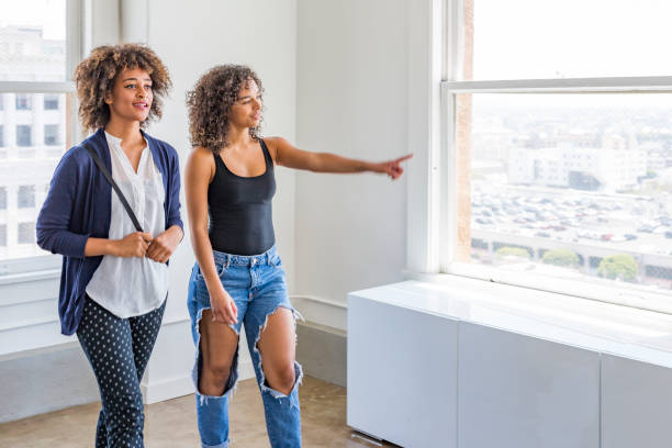 istock Young Women Inspecting a Modern Apartment or Office 937182590