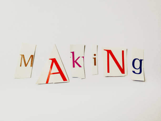 istock Making - Cutout Words Collage Of Mixed Magazine Letters with White Background 937183114