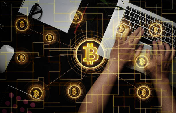 istock Closeup hand using laptop buy or sell virtual currency Bitcoin 937184350