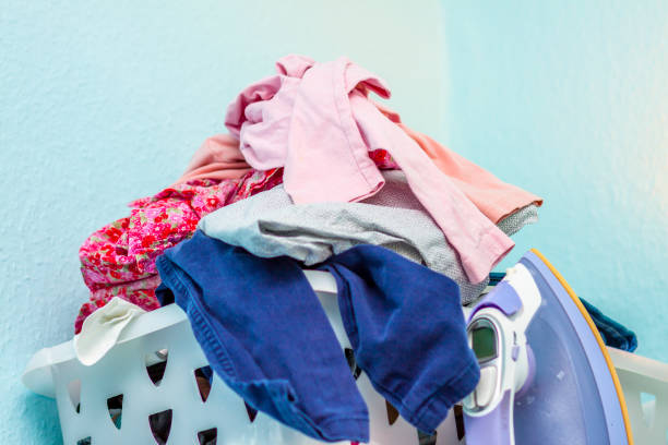 istock Basket full of clothes needs ironing 937190750