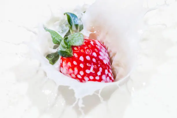 Fresh strawberry in a milk bowl, healthy breakfast food