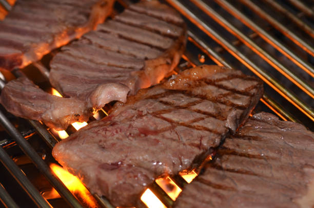 istock Beef steaks on the grill with flames 937202960