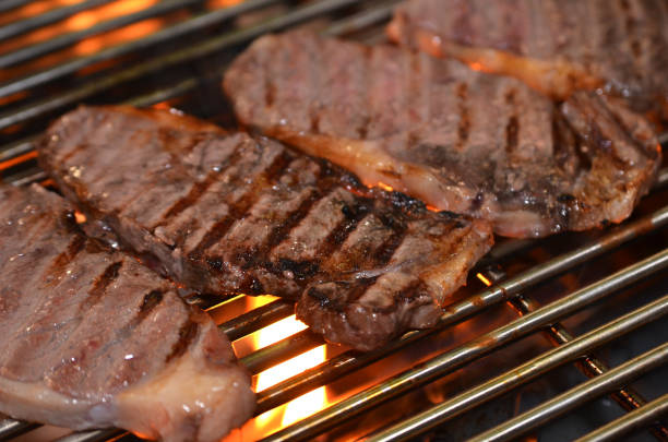 istock Beef steaks on the grill with flames 937203138