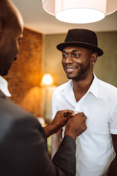 istock gay couple preparing to night out 937209848