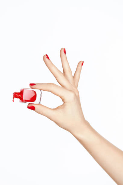 istock Red Nail Polish. Hand With Red Nails On White Background 937210096