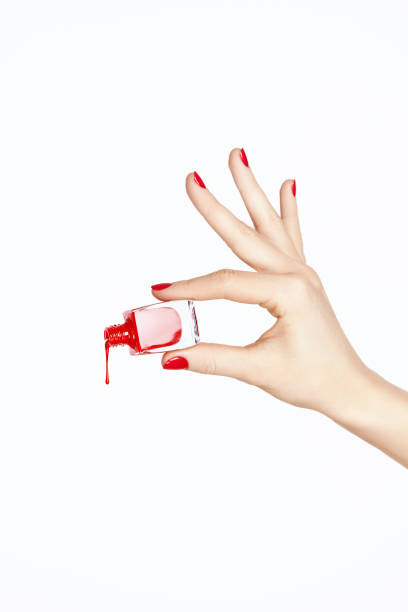 istock Red Nail Polish. Hand With Red Nails On White Background 937210132