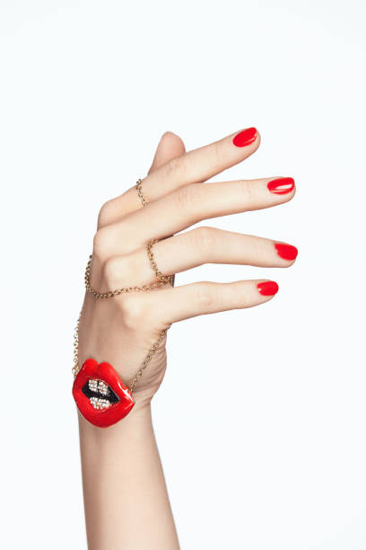 istock Nails Design. Hands With Red Manicure And Red Lips 937213168