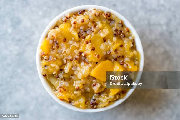 Acai Bowl Quinoa With Tropical Fruits Mango Papaya And Pineapple Stock Photo - Download Image Now