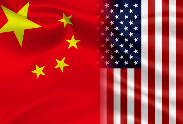 istock China and USA flag background 937217028