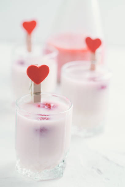 istock Baileys cocktail shots with milk and raspberries. Free space for text. 937218610