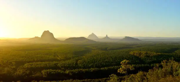 Photo of Panoramic view of Glass House Mountains at sunset in Queensland, Australia.