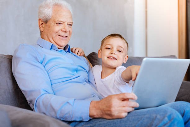 istock Pleasant senior man looking at the laptop screen 937222468