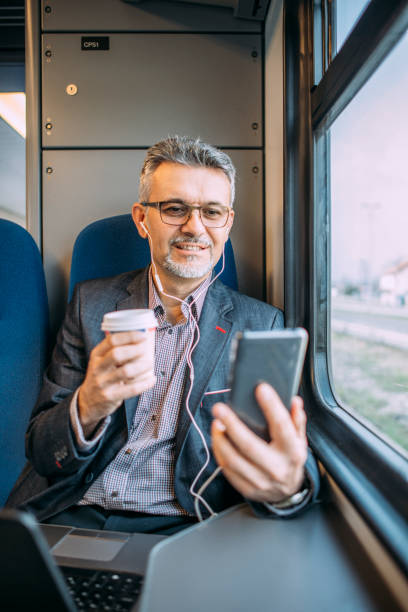 istock Businessman working and traveling by train 937227338
