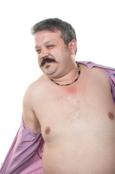 istock Overweight man trying to fasten too small clothes 937227510