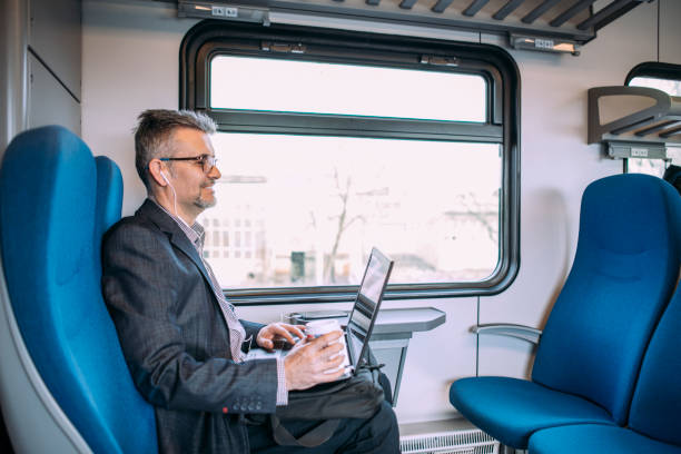 istock Businessman working and traveling by train 937236604