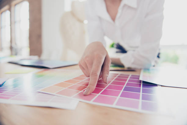 istock Creative occupation. Close up hand of female graphic designer, interior designer, architect, stylist, she is choosing the colors for new project 937236680