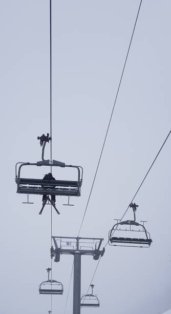 istock Lone Skier taking ski lift 937236960