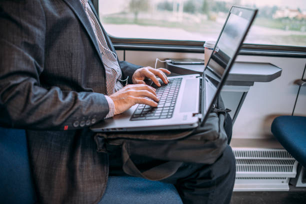 istock Businessman working and traveling by train 937237426