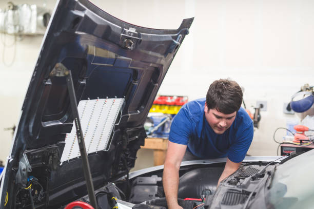 istock Auto Mechanic Working on Race Car in Home Garage 937237964