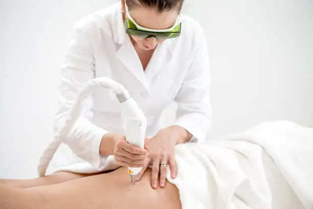 Photo of Dermatologist Removing Patient's Vascular Veins with Laser