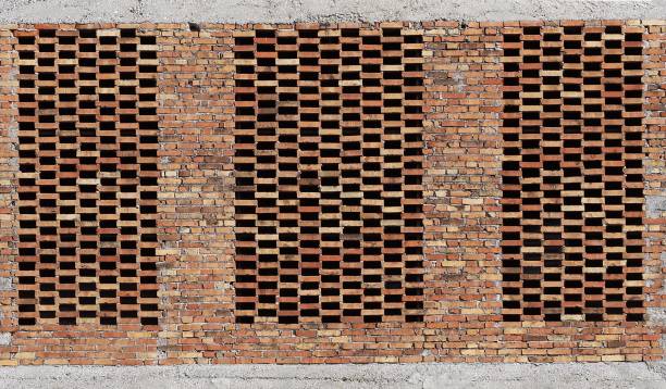 istock Old brick wall with a space between each brick, equal to its size. Once used as a storage of agricultural products 937242448