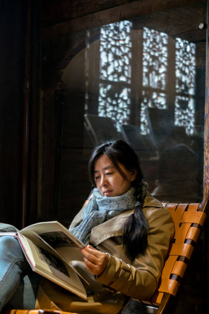 istock girl reading book in old house 937244206