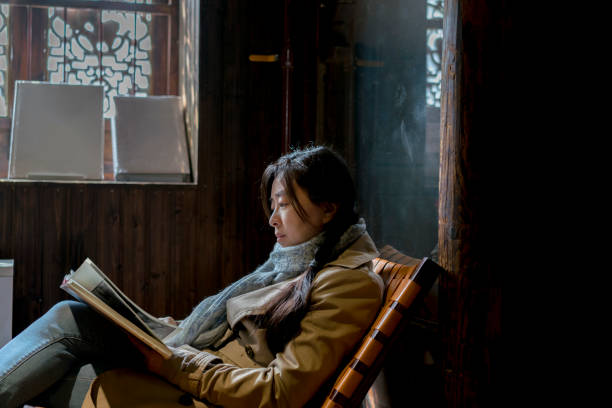 istock girl reading book in old house 937244212