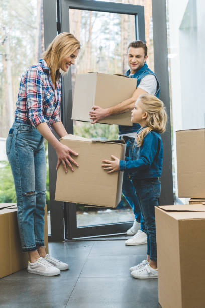 istock young family moving into new house 937244674