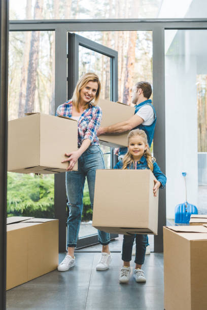istock young family moving into new house 937245146