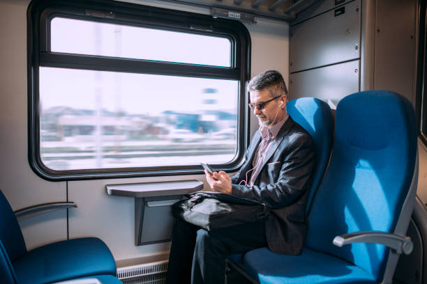istock Businessman working and traveling by train 937245154